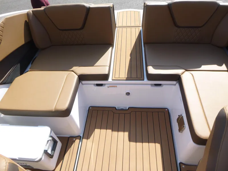 Slide: The Image of 2025 Yamaha Boats 222SD interior with tan seating and teak-style flooring. - 13
