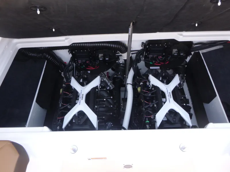 Slide: The Image of 2025 Yamaha Boats 222SD engine compartment with dual engines and wiring. - 14