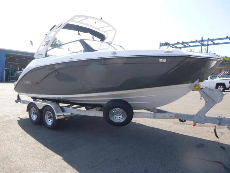 Slide: The Image of 2025 Yamaha Boats 222SD on trailer, sleek design, parked outdoors. - 3