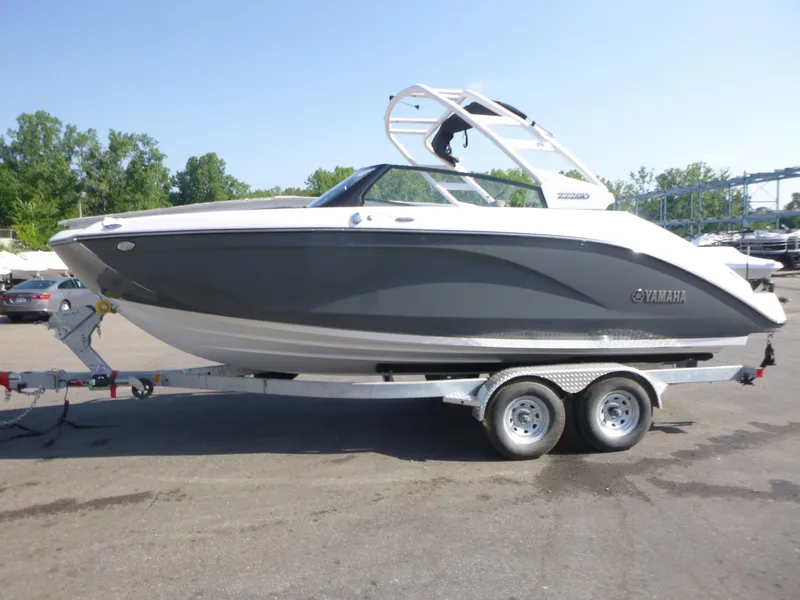 Slide: The Image of 2025 Yamaha Boats 222SD on trailer, sleek design, parked outdoors. - 4