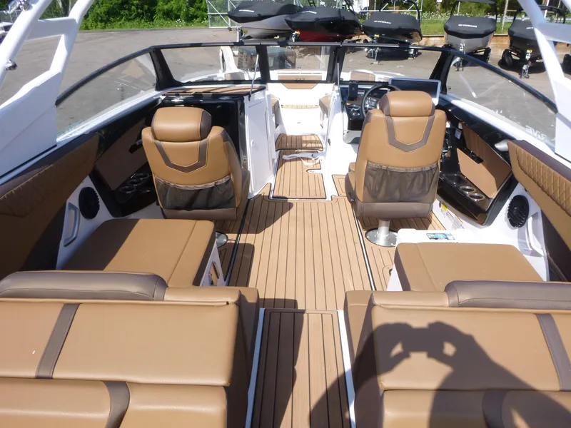 Slide: The Image of 2025 Yamaha Boats 222SD interior with tan seating and sleek design. - 5