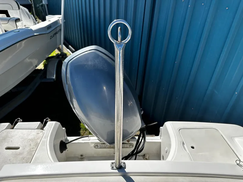 Slide: The Image of 2014 Godfrey Hurricane 188SDS Sport boat with outboard motor and blue backdrop. - 10