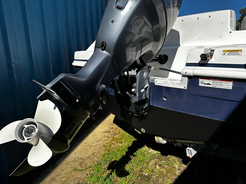 Slide: The Image of 2014 Godfrey Hurricane 188SDS Sport boat engine and propeller detail. - 4