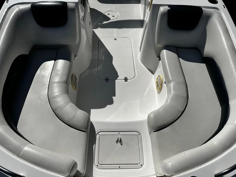 Slide: The Image of 2014 Godfrey Hurricane 188SDS Sport boat interior with gray seating and storage compartments. - 7