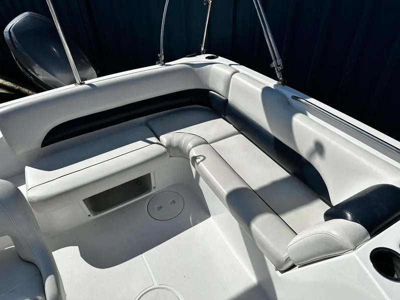 Slide: The Image of 2014 Godfrey Hurricane 188SDS Sport boat interior with white and black seating. - 9