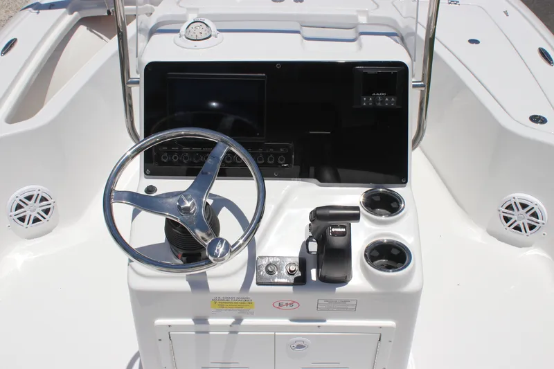Slide: The Image of 2026 Tidewater 1910 Bay Max boat console with steering wheel and controls. - 11