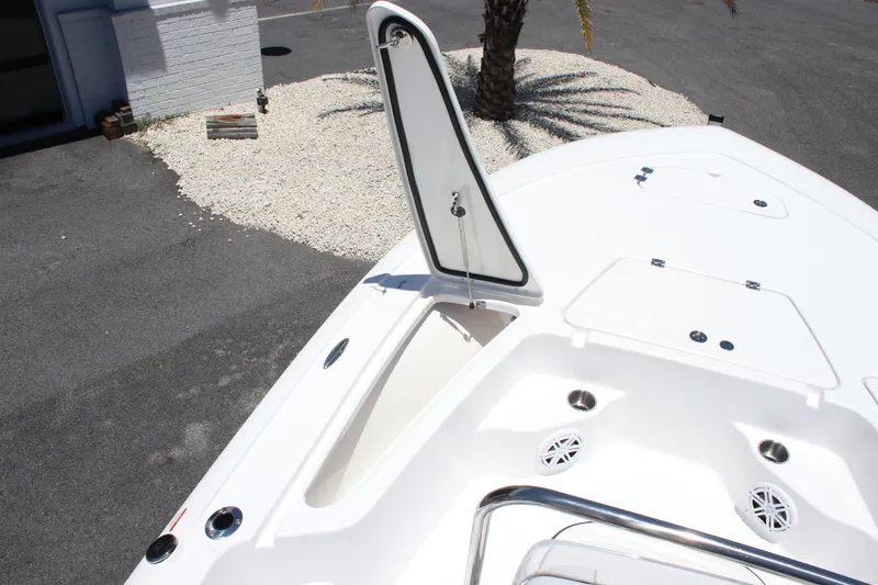 Slide: The Image of 2026 Tidewater 1910 Bay Max boat deck with open storage compartment. - 12