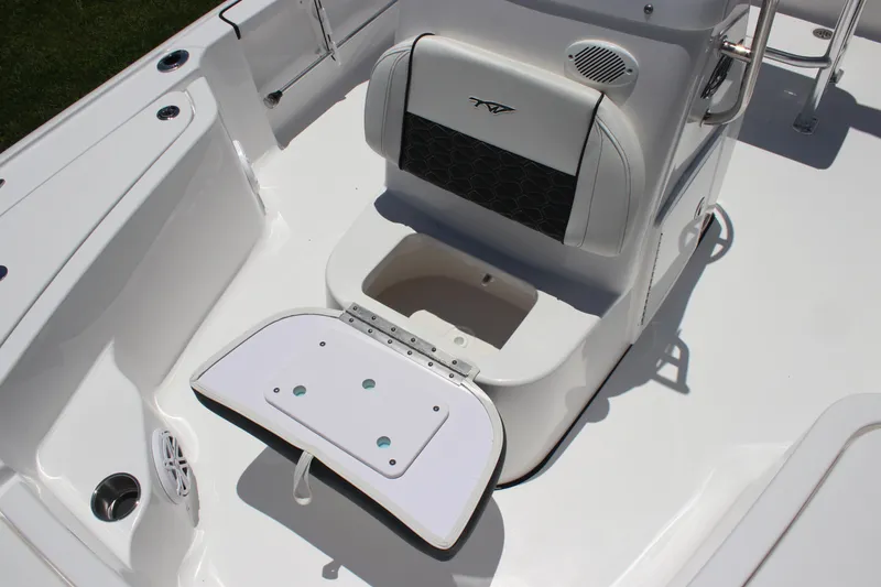 Slide: The Image of 2026 Tidewater 1910 Bay Max boat interior with seating and storage compartment. - 13