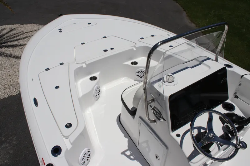 Slide: The Image of 2026 Tidewater 1910 Bay Max boat interior with steering console and seating area. - 16