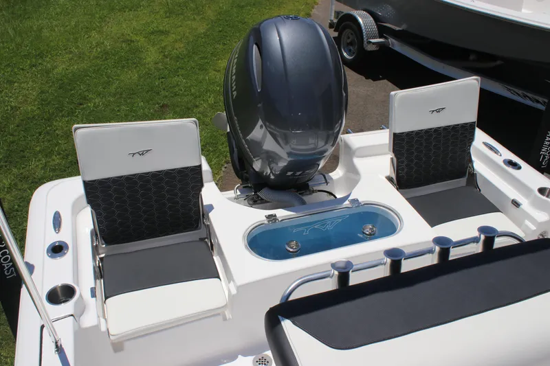 Slide: The Image of 2026 Tidewater 1910 Bay Max boat with Yamaha engine and seating, displayed outdoors. - 20