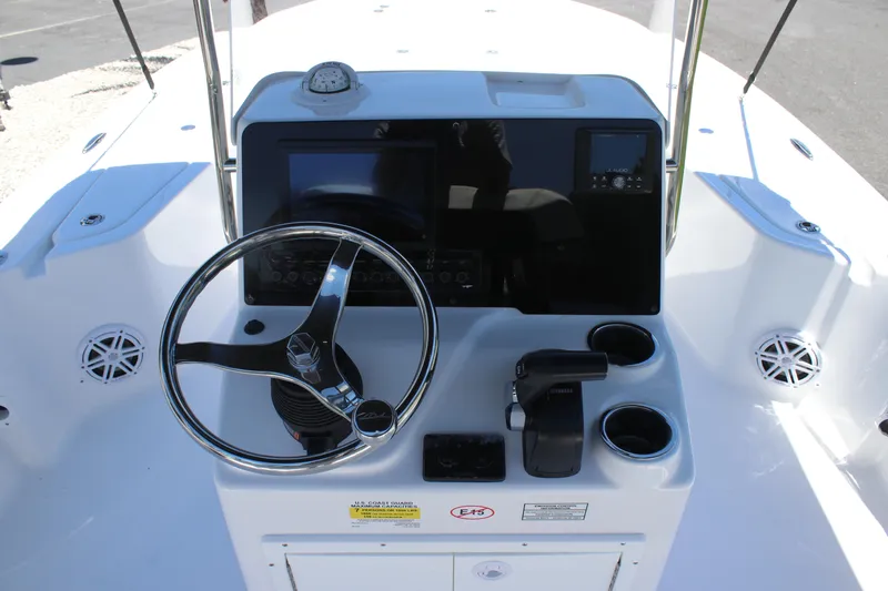 Slide: The Image of 2026 Tidewater 1910 Bay Max boat console with steering wheel and controls. - 23