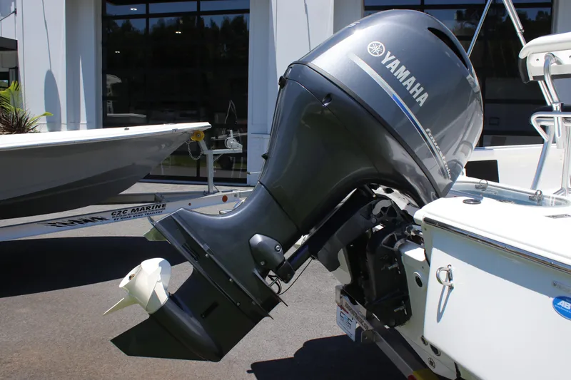 Slide: The Image of 2026 Tidewater 1910 Bay Max with Yamaha outboard motor, displayed outdoors. - 7