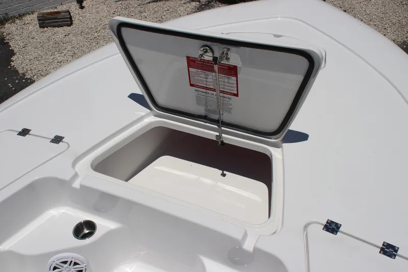 Slide: The Image of Open storage compartment on 2026 Tidewater 1910 Bay Max boat deck. - 9