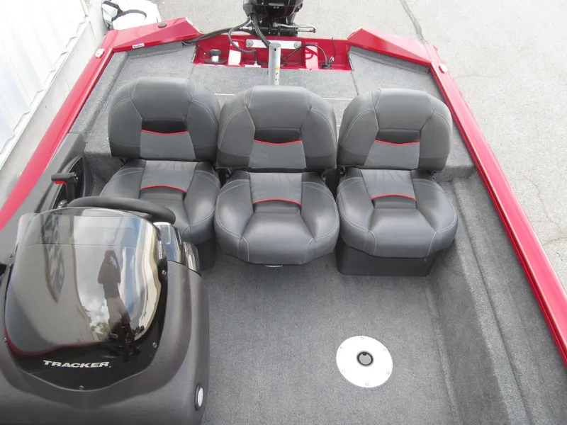 Slide: The Image of 2023 Tracker Pro Team 175 TF boat interior with four gray seats and red accents. - 12