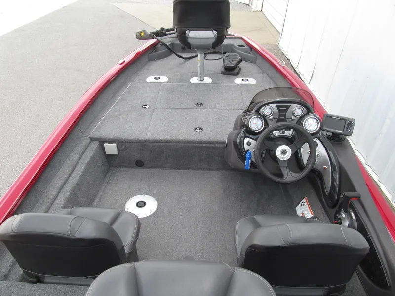 Slide: The Image of 2023 Tracker Pro Team 175 TF boat interior with steering console and seating. - 5