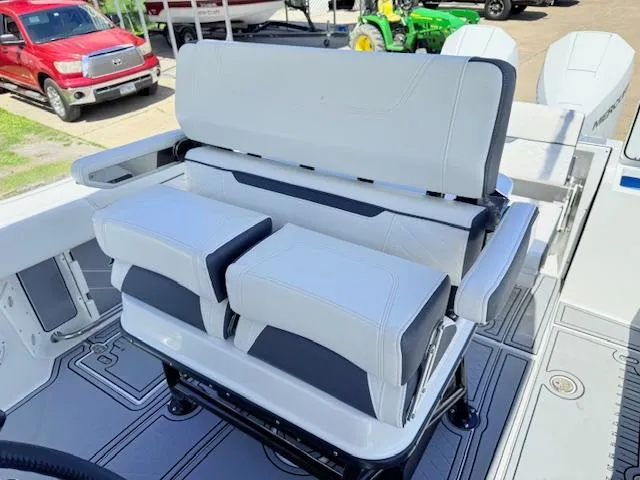 Slide: The Image of 2022 Blackfin 252 CC boat seating with white upholstery and adjustable backrests. - 13