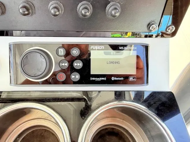 Slide: The Image of 2022 Blackfin 252 CC boat console with storage compartment and red lights. - 17