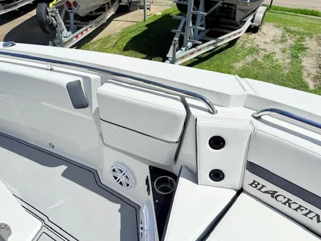 Slide: The Image of 2022 Blackfin 252 CC boat interior with white seating and sleek design. - 24