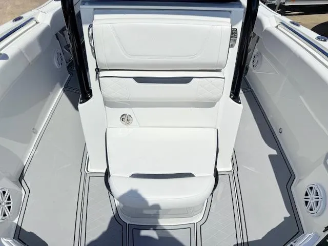 Slide: The Image of 2022 Blackfin 252 CC boat with Garmin radar, parked outdoors. - 25