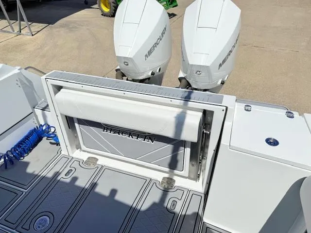 Slide: The Image of 2022 Blackfin 252 CC boat with white seating and dual Mercury engines. - 7