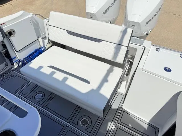 Slide: The Image of 2022 Blackfin 252 CC boat livewell with open lid, showcasing interior design. - 8