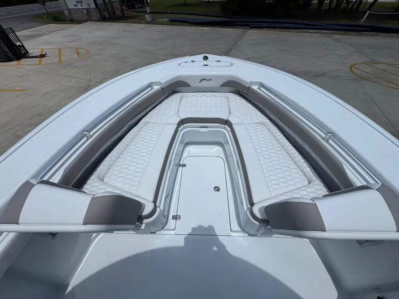 Slide: The Image of 2026 Yellowfin 26 Hybrid boat with white cushioned seating and sleek design. - 18