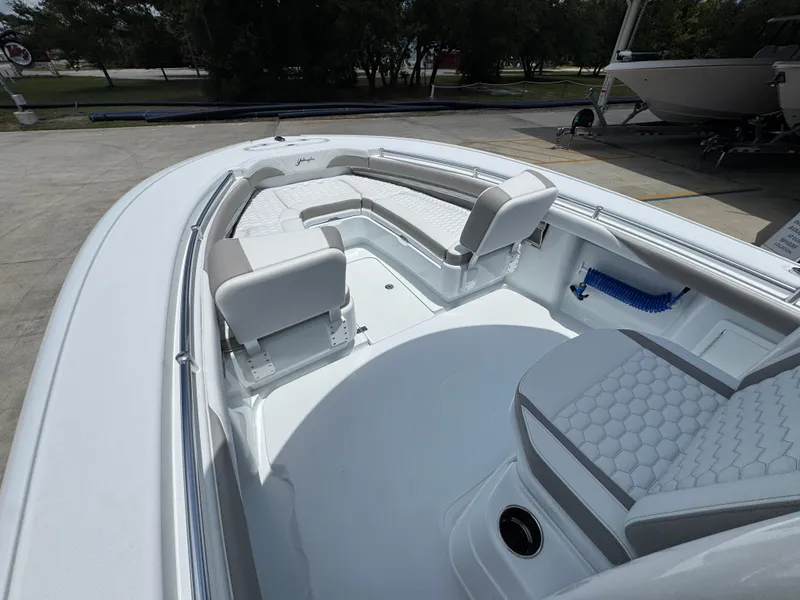 Slide: The Image of 2026 Yellowfin 26 Hybrid boat interior with cushioned seating and sleek design. - 19