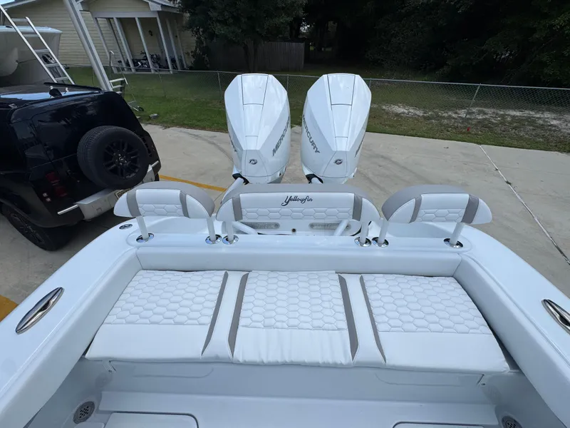 Slide: The Image of 2026 Yellowfin 26 Hybrid boat with dual Mercury engines and white cushioned seating. - 38