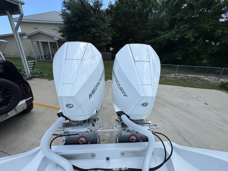 Slide: The Image of Twin Mercury outboard engines on a 2026 Yellowfin 26 Hybrid boat. - 39