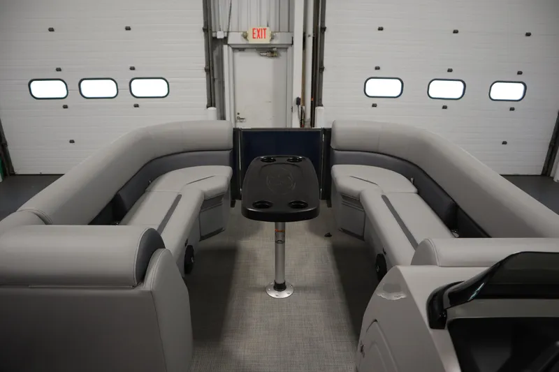 Slide: The Image of 2025 Bentley Pontoons 240 Navigator interior with gray seating and central table. - 11