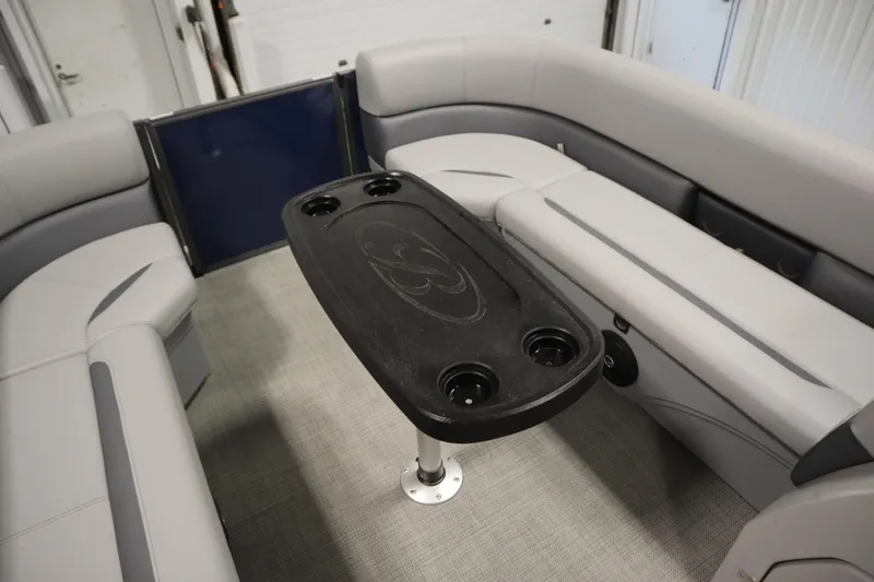 Slide: The Image of 2025 Bentley Pontoons 240 Navigator interior with seating and table. - 17