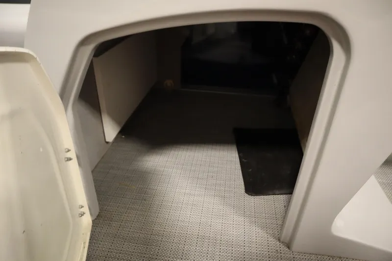 Slide: The Image of Interior cabin of 2025 Bentley Pontoons 240 Navigator, featuring carpeted flooring. - 19