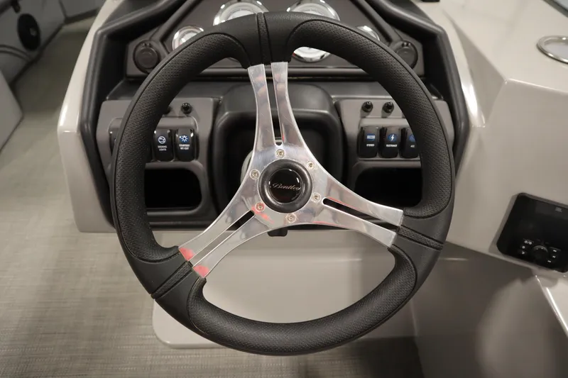 Slide: The Image of Steering wheel of 2025 Bentley Pontoons 240 Navigator with control panel. - 21