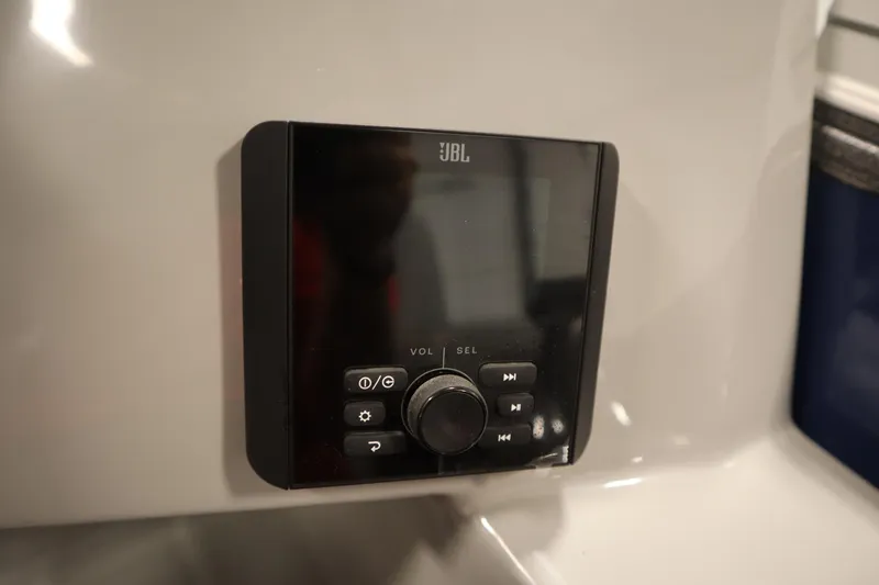 Slide: The Image of JBL audio control panel on 2025 Bentley Pontoons 240 Navigator. - 25