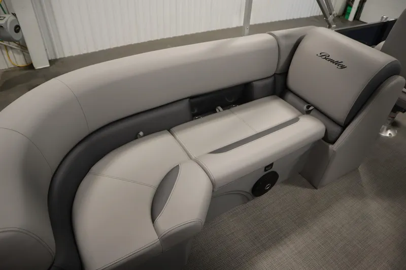 Slide: The Image of 2025 Bentley Pontoons 240 Navigator interior seating with gray upholstery and Bentley logo. - 31