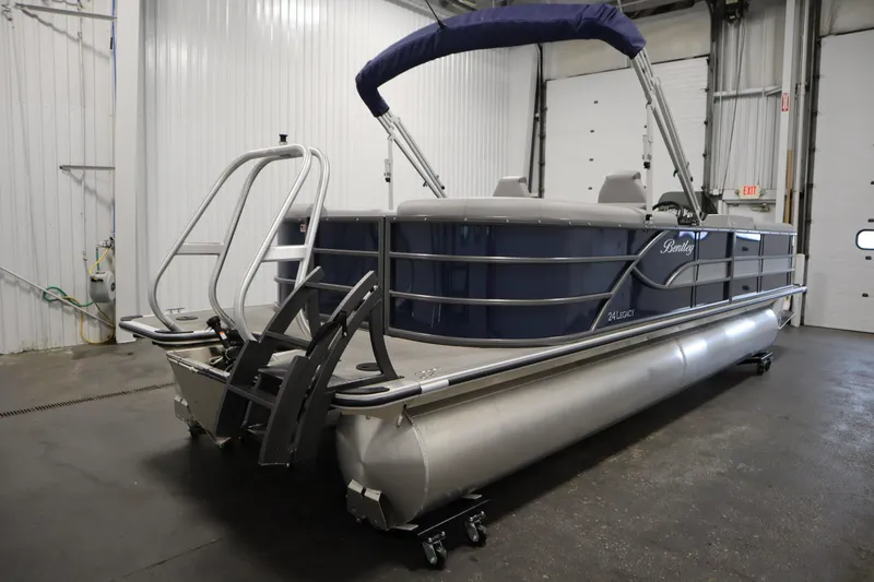 Slide: The Image of 2025 Bentley Pontoons 240 Navigator in a showroom, featuring sleek design and modern amenities. - 5