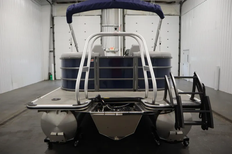 Slide: The Image of 2025 Bentley Pontoons 240 Navigator in a spacious indoor showroom. - 6