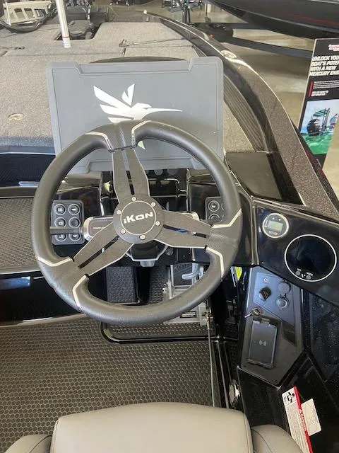 Slide: The Image of Steering wheel of 2026 iKon VLX 20 boat, featuring modern controls and dashboard. - 4