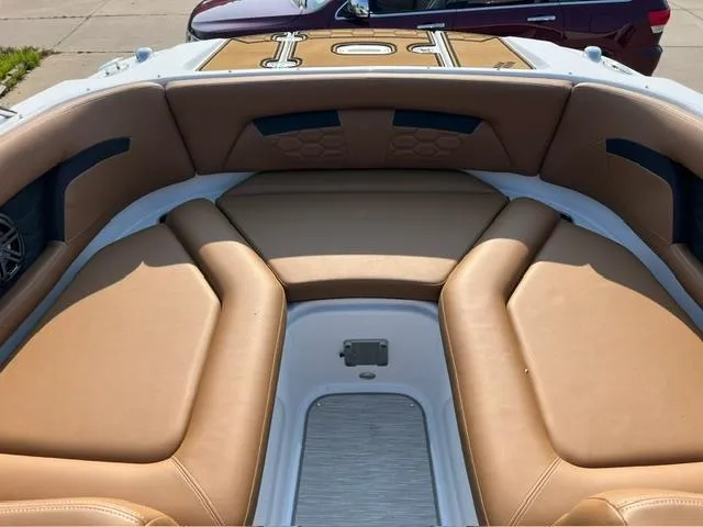 Slide: The Image of 2023 Four Winns HD3 boat with tan leather seating and sleek design. - 5