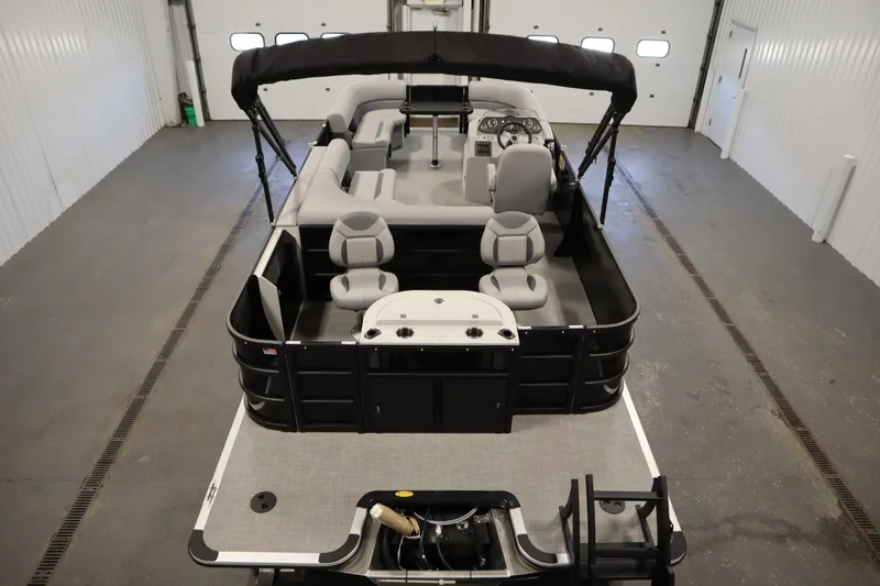 Slide: The Image of 2025 Bentley Pontoons 220 Fish-N-Cruise with spacious seating in a showroom. - 10