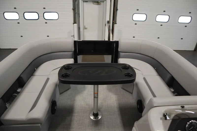 Slide: The Image of 2025 Bentley Pontoons 220 Fish-N-Cruise storage compartment with cushioned seating. - 11