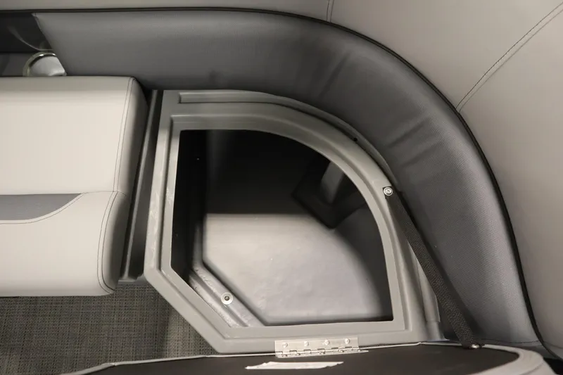 Slide: The Image of 2025 Bentley Pontoons 220 Fish-N-Cruise interior with seating and table in a garage. - 14