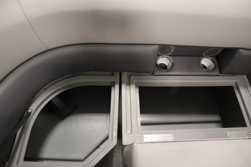 Slide: The Image of 2025 Bentley Pontoons 220 Fish-N-Cruise storage compartment with cup holders and seating. - 16