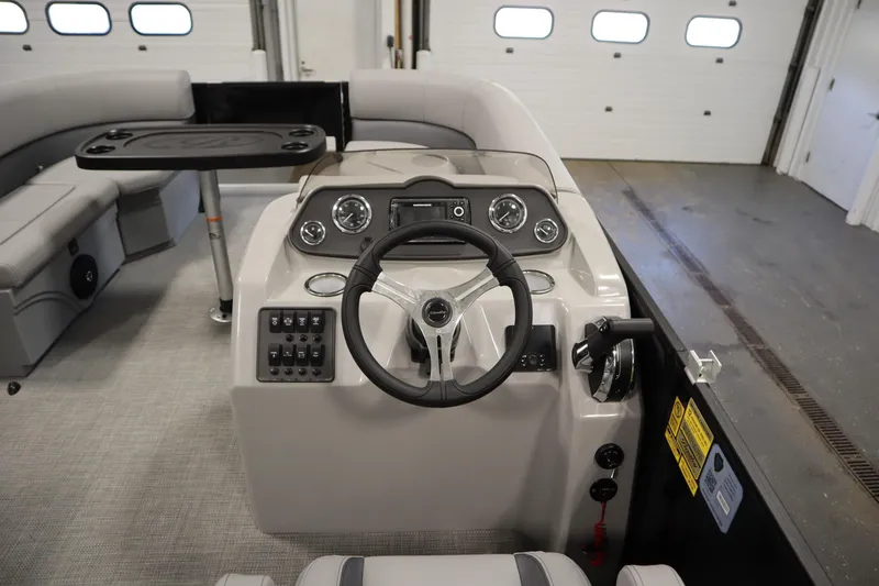 Slide: The Image of 2025 Bentley Pontoons 220 Fish-N-Cruise interior storage compartments and cup holders. - 19