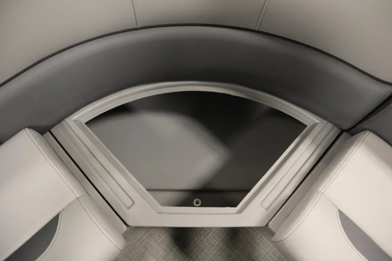 Slide: The Image of 2025 Bentley Pontoons 220 Fish-N-Cruise storage compartment with cup holders, gray interior. - 29