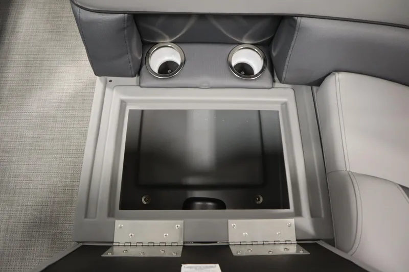 Slide: The Image of 2025 Bentley Pontoons 220 Fish-N-Cruise storage compartment with cup holders and gray interior. - 30