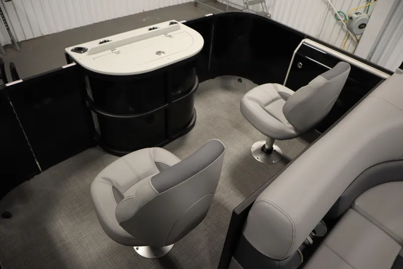 Slide: The Image of 2025 Bentley Pontoons 220 Fish-N-Cruise interior with plush captain's chair and steering wheel. - 31