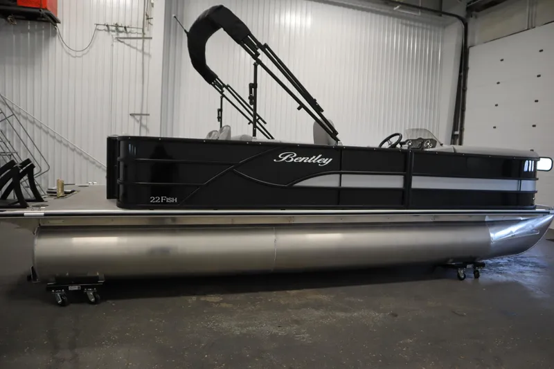 Slide: The Image of 2025 Bentley Pontoons 220 Fish-N-Cruise pontoon boat in a garage setting. - 4