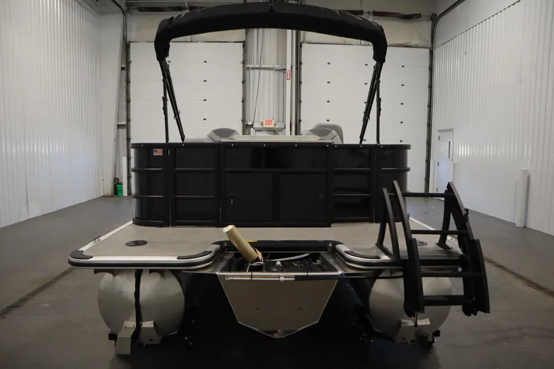 Slide: The Image of 2025 Bentley Pontoons 220 Fish-N-Cruise in a garage, side view. - 6