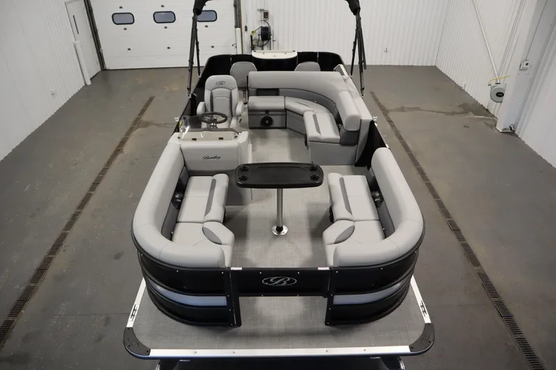 Slide: The Image of 2025 Bentley Pontoons 220 Fish-N-Cruise in a showroom, showcasing sleek design and features. - 9